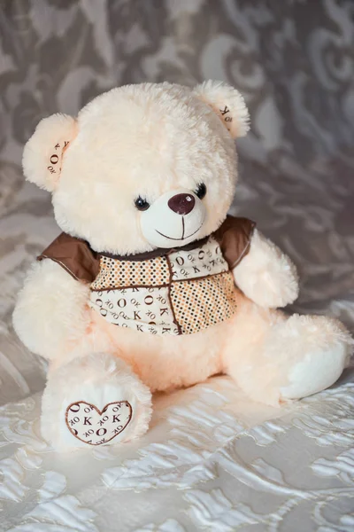 Cute teddy bear sitting Stock Photo by ©OlgaChan 130236608
