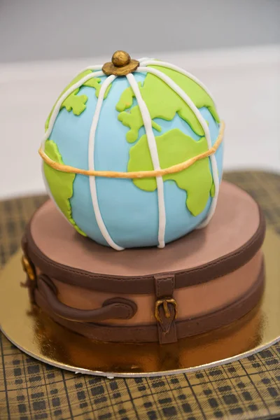 childrens themed birthday travel. smash the cake. sweet globe on a suitcase