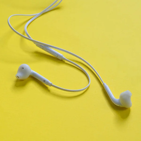 Pair Earphones Yellow Surface — Stock Photo, Image