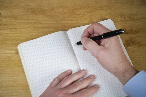 Hombre Escribiendo Cuaderno Cuadrado — Foto de Stock