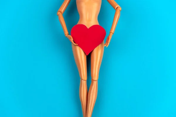 Legs Plastic Doll Red Heart Covering Crotch Vibrant Blue Background — Stock Photo, Image