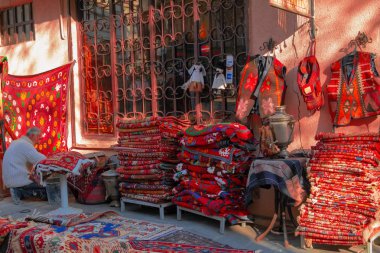 Tbilisi, Georgia, 18 December 2019 -  vintage style Oriental carpets stacks on a street carpets market