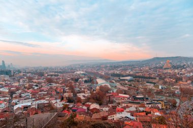 Tbilisi, Georgia, 15 December 2019 - aerial view of the old city from the observation deck on the background of beautiful sunset sky