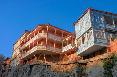 residential buildings with traditional carved wooden balconies on the rock of Tbilisi, Georgia
