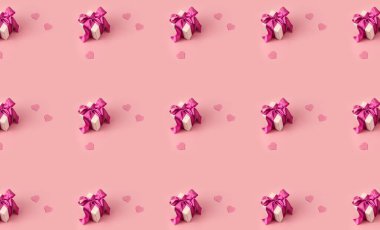 Pembe arkaplanda pembe kalplerle süslenmiş yaratıcı desenli hediye kutusu.
