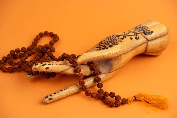 Wooden Female Hand Holds Rosary Bright Orange Background Meditation Concept — 스톡 사진