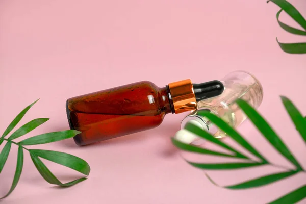 Glass Bottle Oil Pipette Yellow Background Green Palm Leaves — Stock Photo, Image