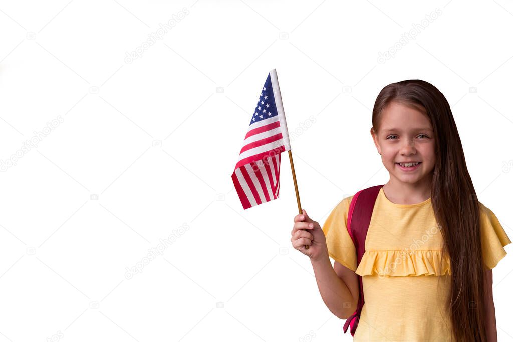 cute smiling little girl holding american flag isolated on white background,copy space