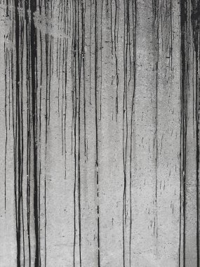 sıvı siyah boya beton duvardan aşağı akıyor soyut arkaplanı kapat