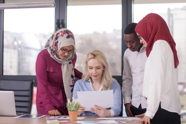 Multiethnic group of young business persons at office — Stock Photo, Image