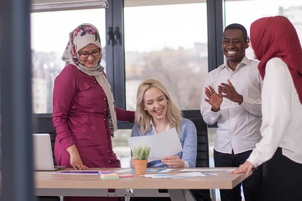 Multiethnic group of young business persons at office — Stock Photo, Image