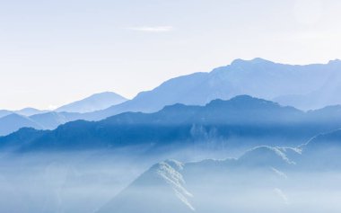 Hazy blue mountains of Zhushan, Alishan in Taiwan clipart