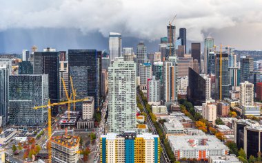 Seattle, Washington, USA - October 9, 2019: Aerial view of downtown in Seattle from Space Needle on rainy day, some buildings are on construction.