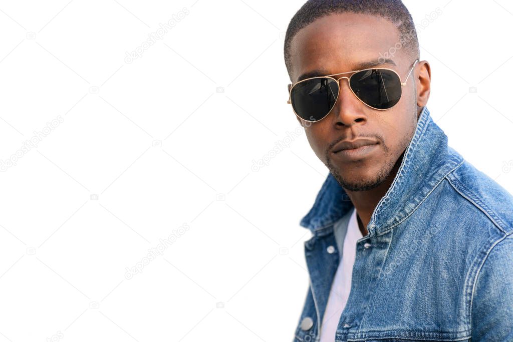 Close up headshot commercial model, looking confident, cool, fashionable in dark sunglasses and jean jacket