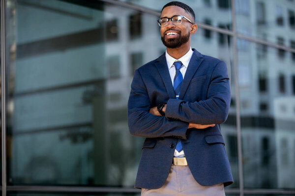 Stylish handsome commercial model business man, executive, corporate professional in modern chic suit, charming smile, candid pose