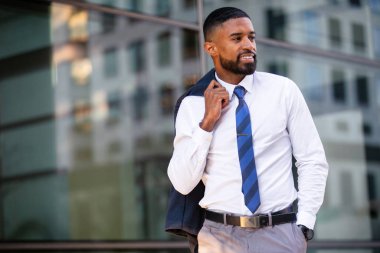 Casual candid lifestyle portrait of a successful stylish distinguished african american business man, possibly lawyer, financial representative, professional salesman
