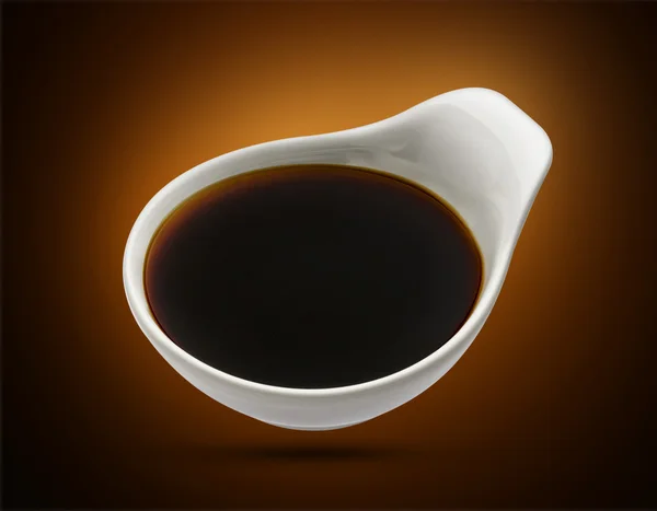 Soy sauce in bowl isolated, shoyu closeup in dish — Stock Photo, Image