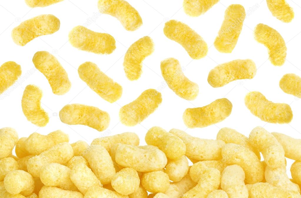 Crunchy corn sticks flakes isolated on white background
