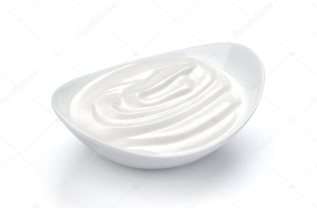 Sour cream in bowl isolated on white background