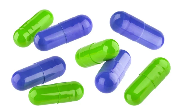 Cápsulas de píldora médica azul y verde aisladas sobre fondo blanco — Foto de Stock