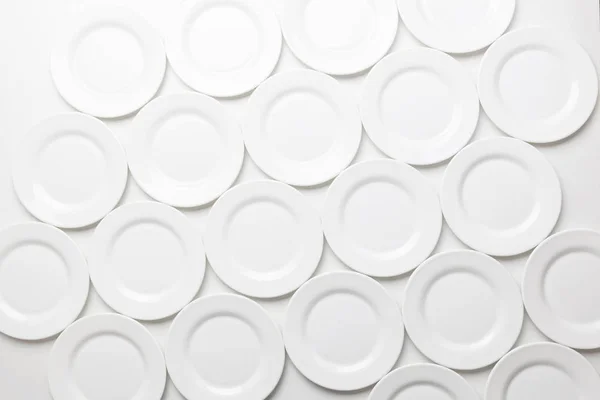 White round plates isolated on white background, top view — Stock Photo, Image