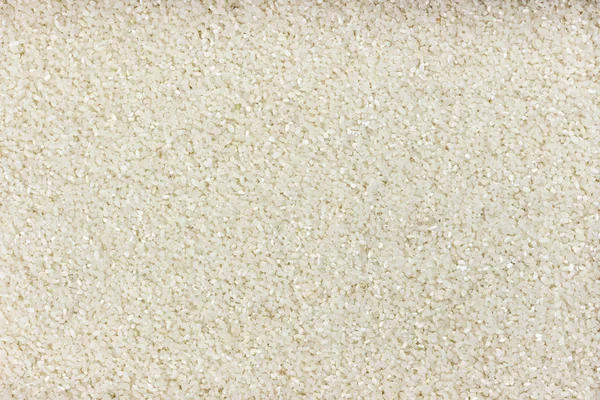 Küçük ezilmiş pirinç arka plan veya doku — Stok fotoğraf