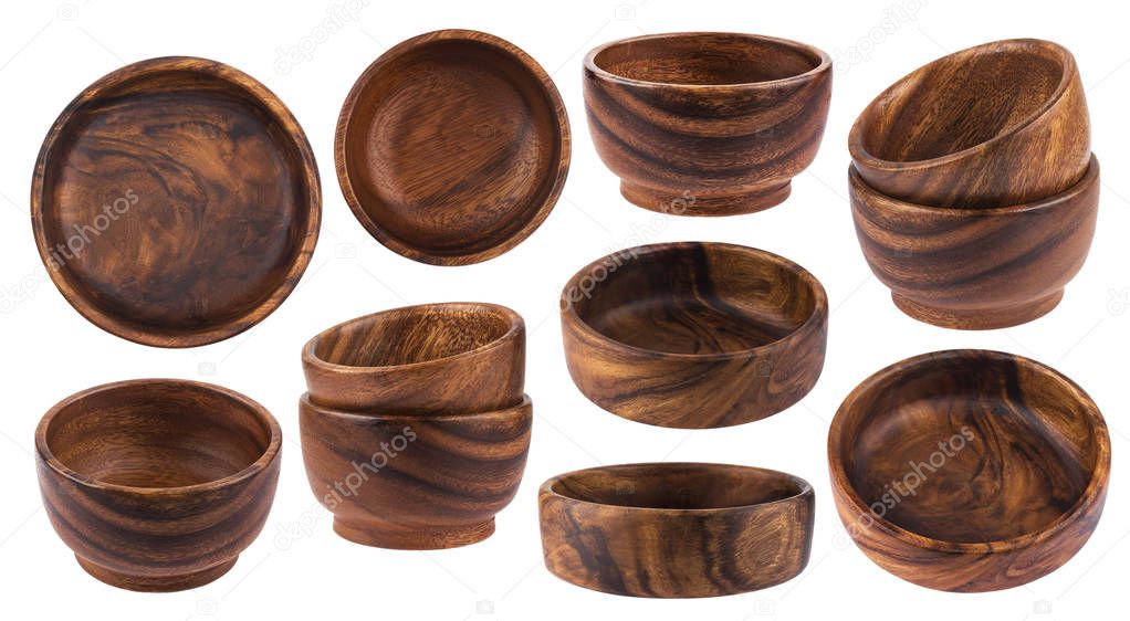 Collection of empty wooden bowls isolated on white background