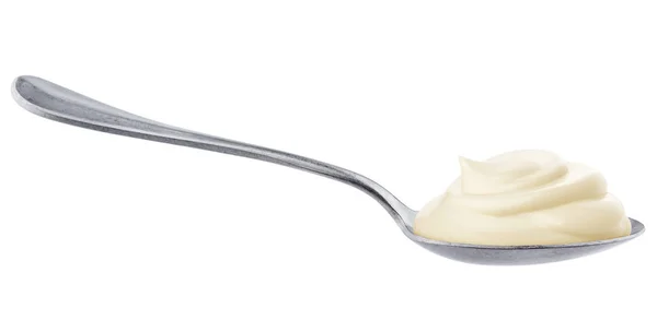 Sour cream in spoon isolated on white background — Stock Photo, Image