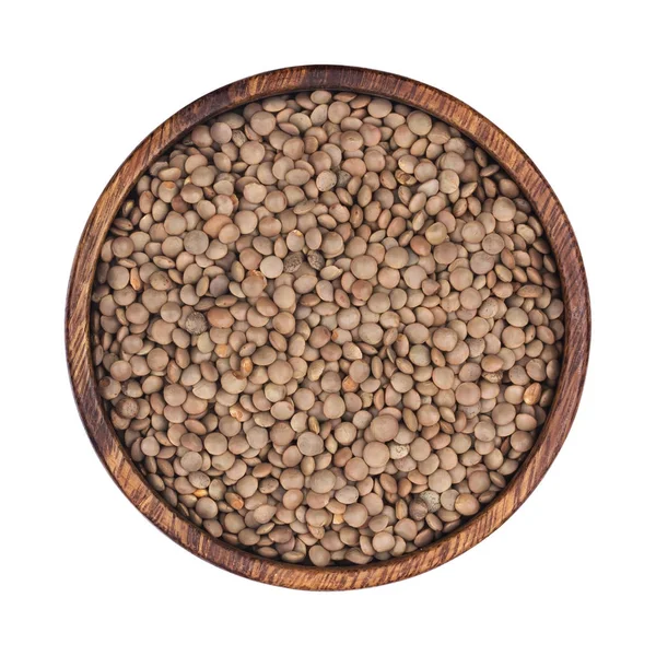 Lentils in wooden bowl isolated on white background. Top view — Stock Photo, Image