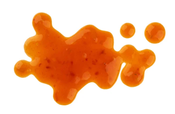 Manchas de molho doce e azedo. Salpicos e molho de laranja derramado isolado no fundo branco. Vista superior — Fotografia de Stock