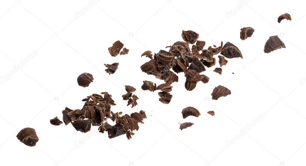 Grated chocolate pieces isolated on white background, closeup