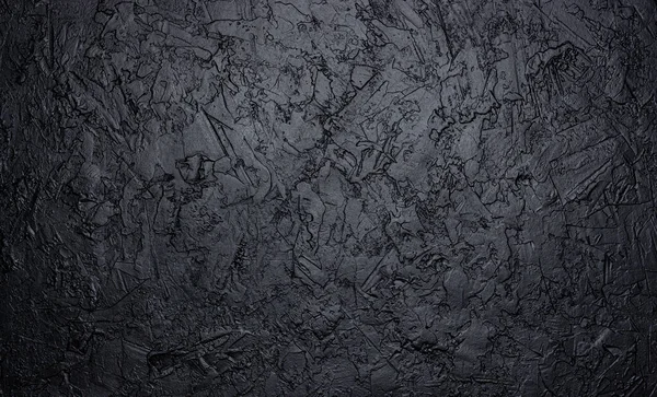 Black stone texture, dark slate background, top view