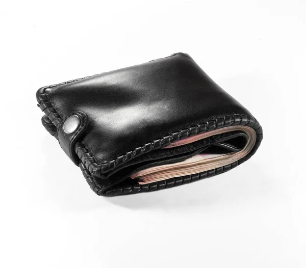 Black purse full of money tight — Stock Photo, Image