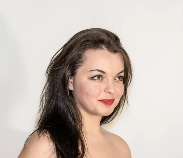 Portrait of beautiful girl with black hair on white background. — Stock Photo, Image