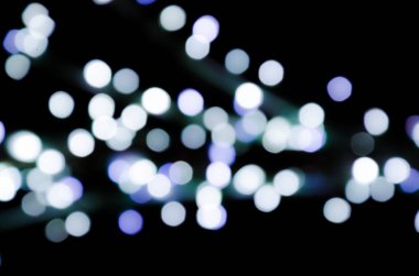 Renkli ışıklar, çelenk. Bulanık fotoğraf. Kutlama arka plan.