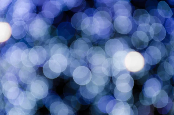 Colored lights, garlands. Blurred photo. Celebratory background. — Stock Photo, Image