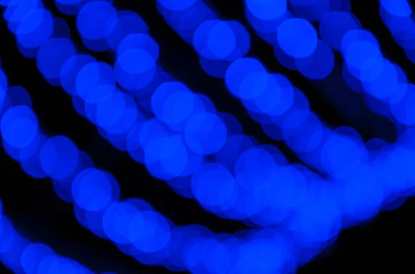 Blue lights, garlands. Blurred photo. Celebratory background. — Stock Photo, Image