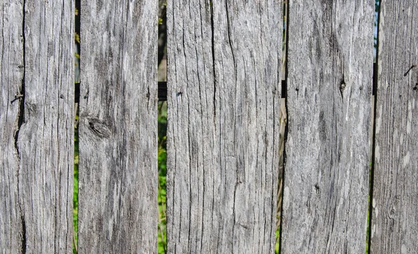 Vecchie assi di legno grigie, recinzione. Sfondo vintage — Foto Stock