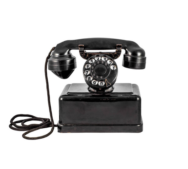 Old vintage black phone on white background