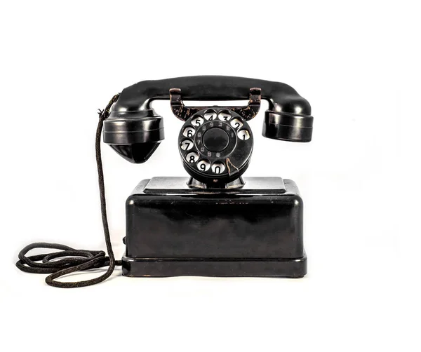 Oude vintage zwarte telefoon op witte achtergrond — Stockfoto