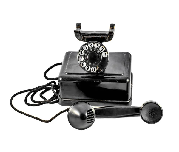 Old vintage black phone shot on white background — Stock Photo, Image