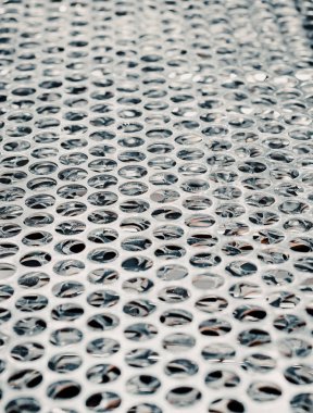 Lazer kesimli daireleri olan metal levhalar. Sanayi geçmişi.