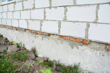 Close up on new building house construction foundation wall waterproofing.  clipart