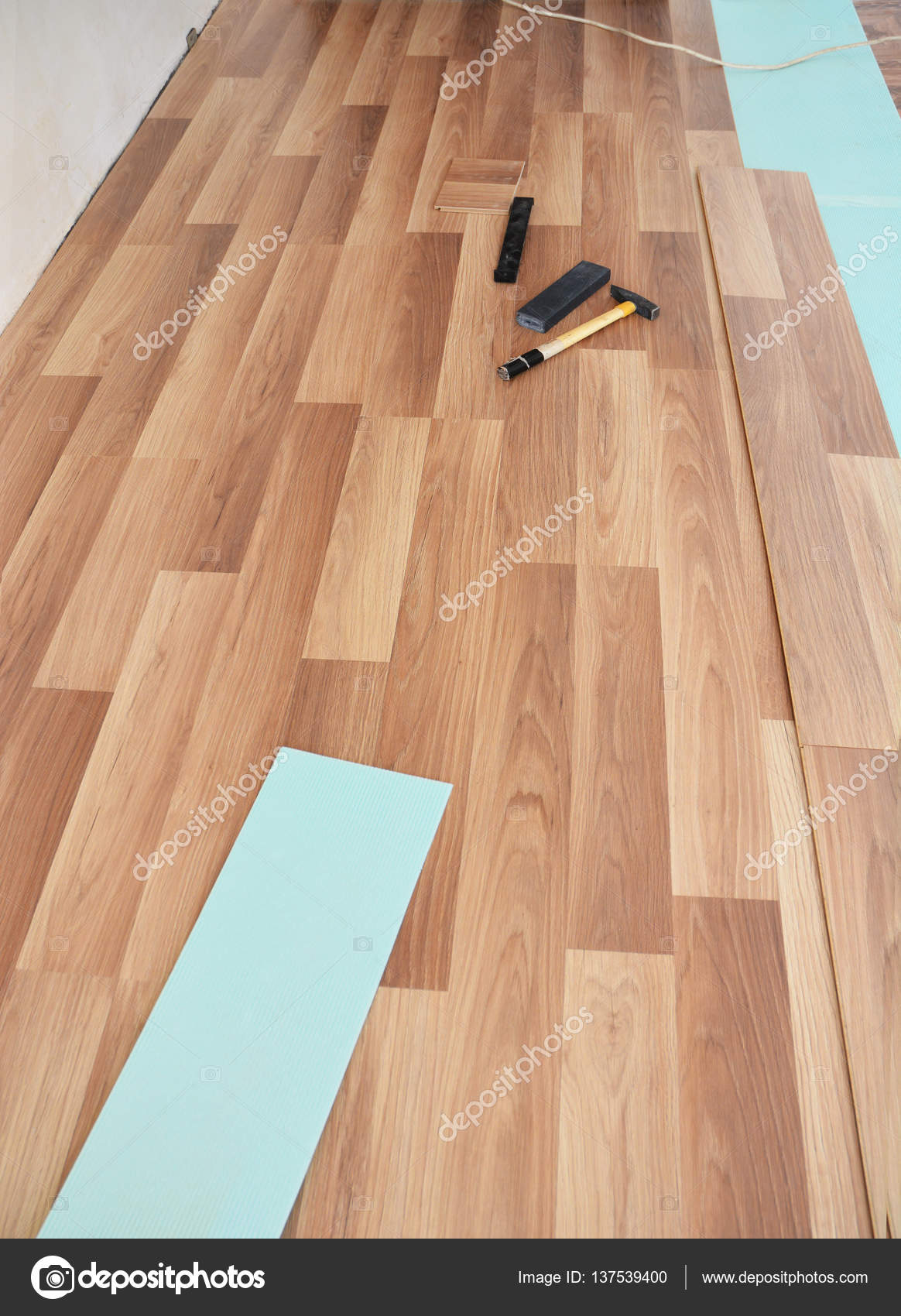 Installing Wooden Laminate Flooring With Tools Stock Photo Installing Wooden Laminate Flooring With Tools Stock Photo