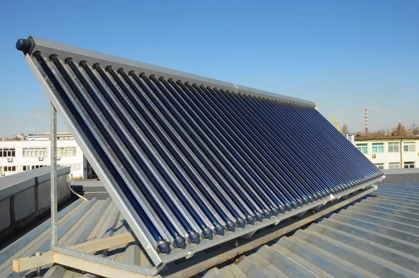 Solar water heating (SWH) systems use solar panels, called collectors, fitted to your roof. Energy efficiency concept. Solar Hot water panels heating. — Stock Photo, Image