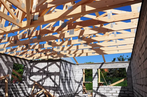 Roof trusses construction. Wooden Roof Frame House Construction. Roofing Construction.