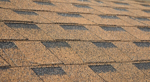 Asphalt Shingles Soft Focus Photo. Close up view on Asphalt Roofing Shingles Background. Roof Shingles - Roofing Construction, Roofing Repair.