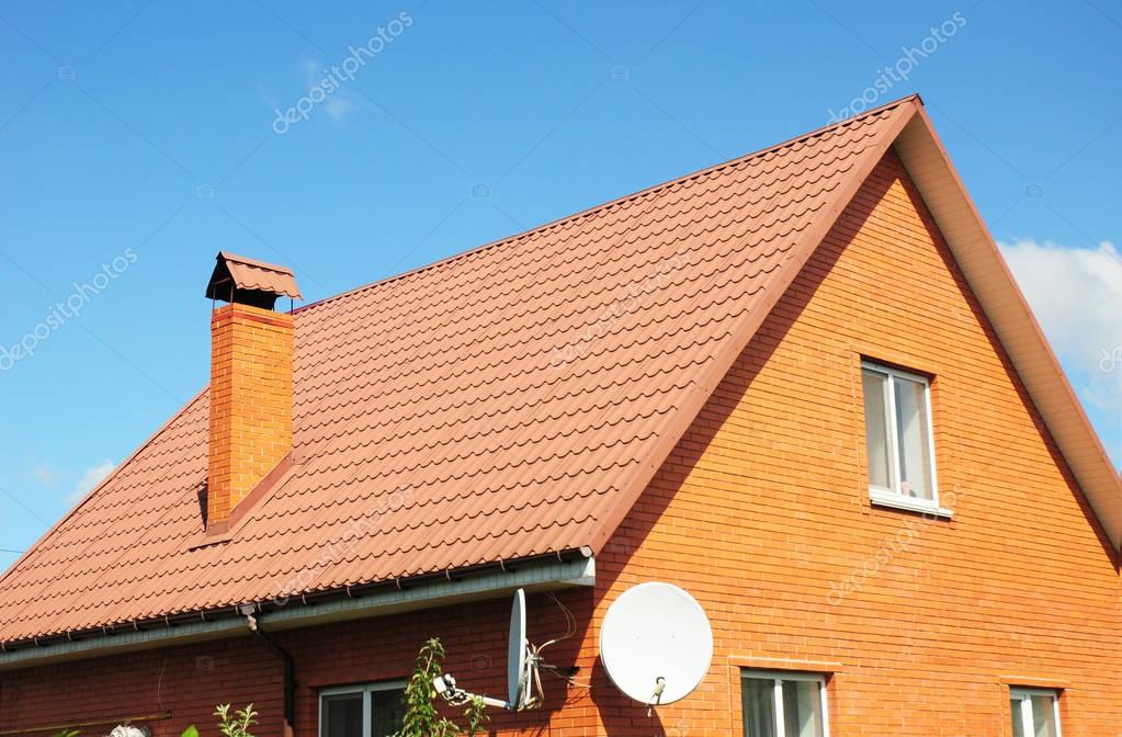 Red old metal house roof tiles. Metal Roof Shingles Roofing