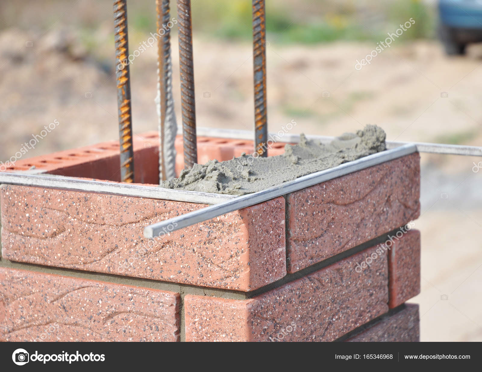 Installing Red Clinker Blocks and Caulking Brick Masonry Joints