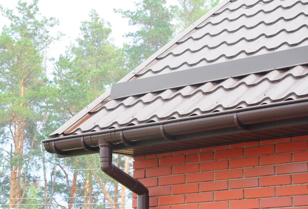 Rain gutter system and roof protection from snow (Snow guard). — Stock Photo, Image